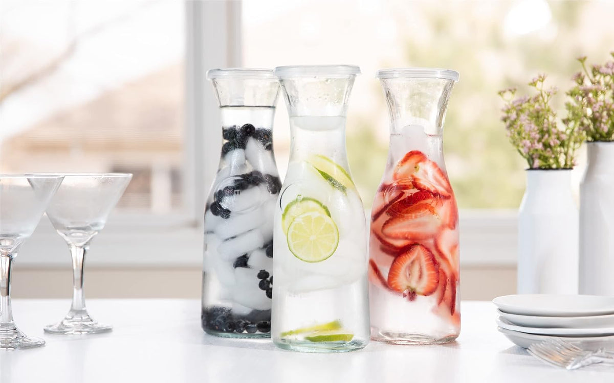 Kook Glass Carafe, Mimosa Bar Supplies, Carafe Pitchers with Lid, Glass Water Pitcher, Drink Dispensers for Parties, Tea, Wine, and Juice, Plastic Lids, Dishwasher Safe, 35 oz (set of 4)